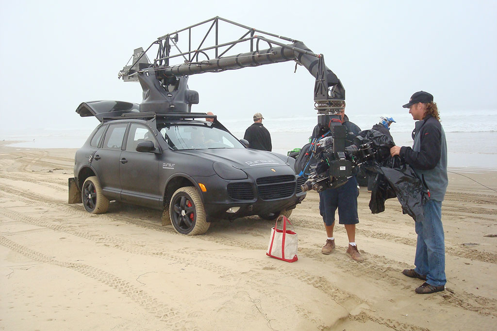 Filming equipment mounted on a car.
