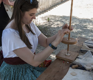 Woman spinning wool Woman spinning wool