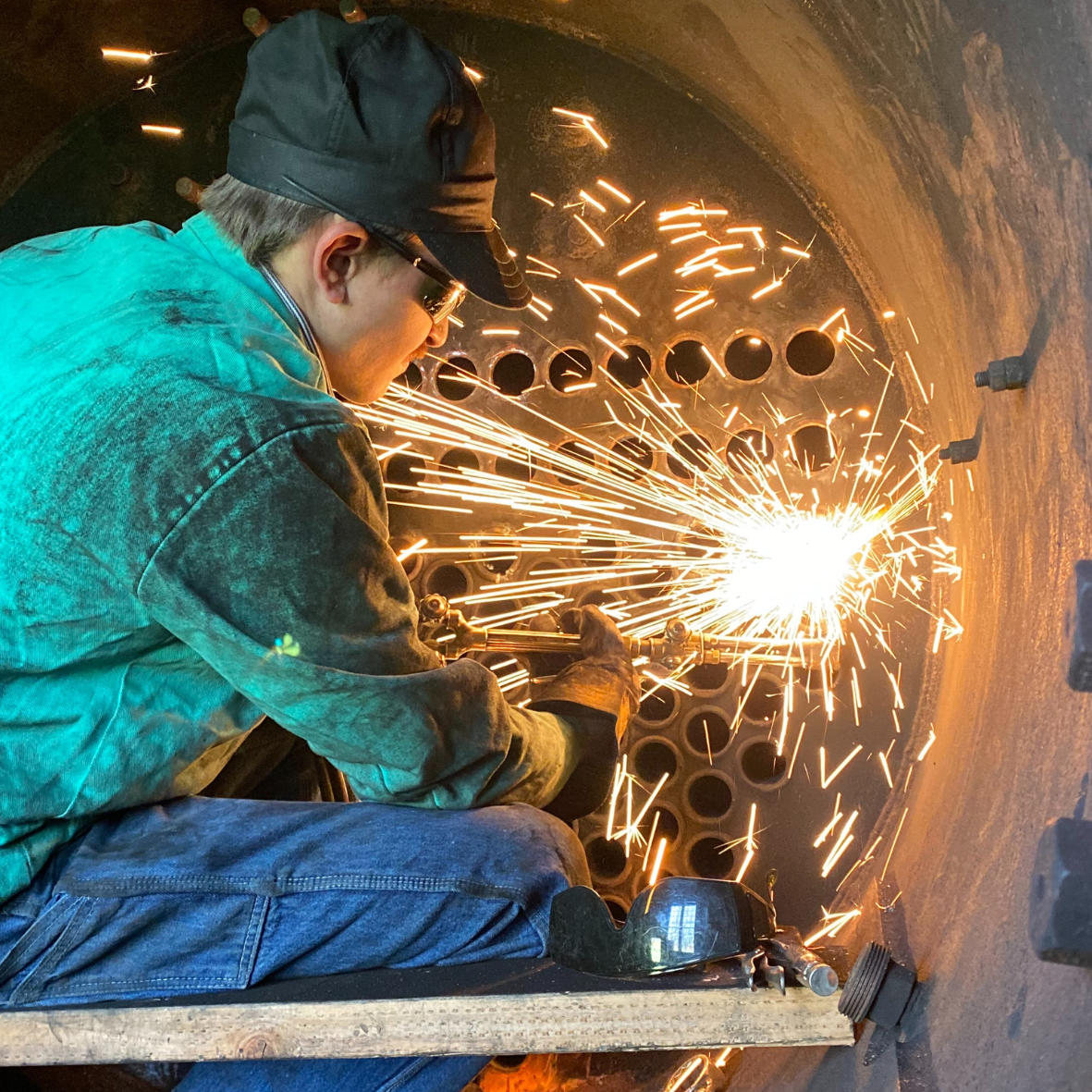 Employee working and sparks flying 