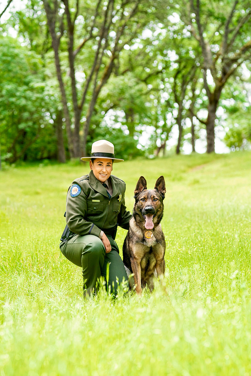 State Park Peace Officer Alex Lucero with K-9 Rex at Folsom Lake State Recreation Area. Photo from California State Parks.