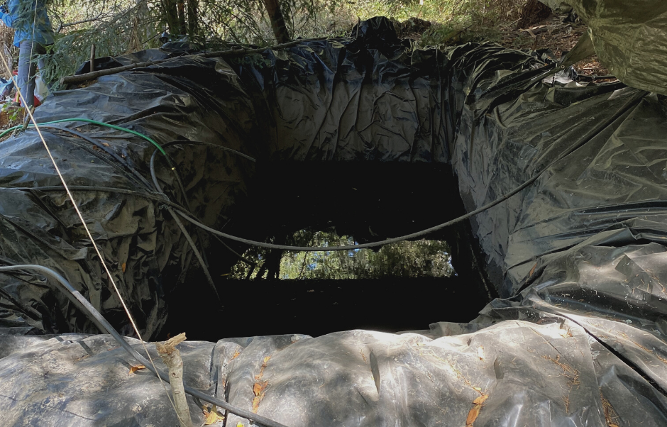 One of several large pits dug by growers to water cannabis plants.