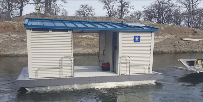 Floating restroom shown above during December 2019 deployment at Lake Berryessa. The floating restrooms available for the 2021/22 grant cycle were designed by California State Parks engineering group. Each ADA-compliant unit holds about 500 gallons of sewage and can be towed to the shore for scheduled pumpouts or pumped out onsite by pumpout boats. Photo from Division of Boating and Waterways.